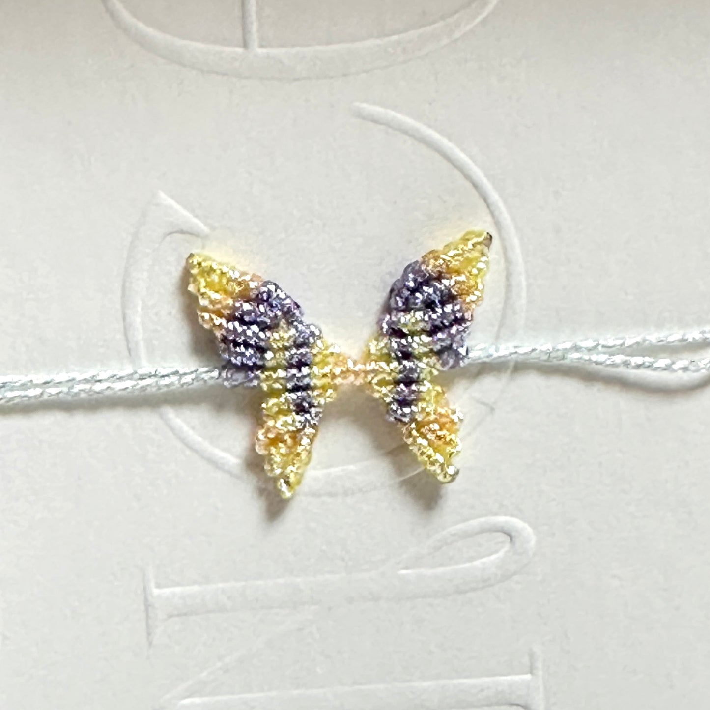 Handwoven gold and silver thread butterfly bracelet