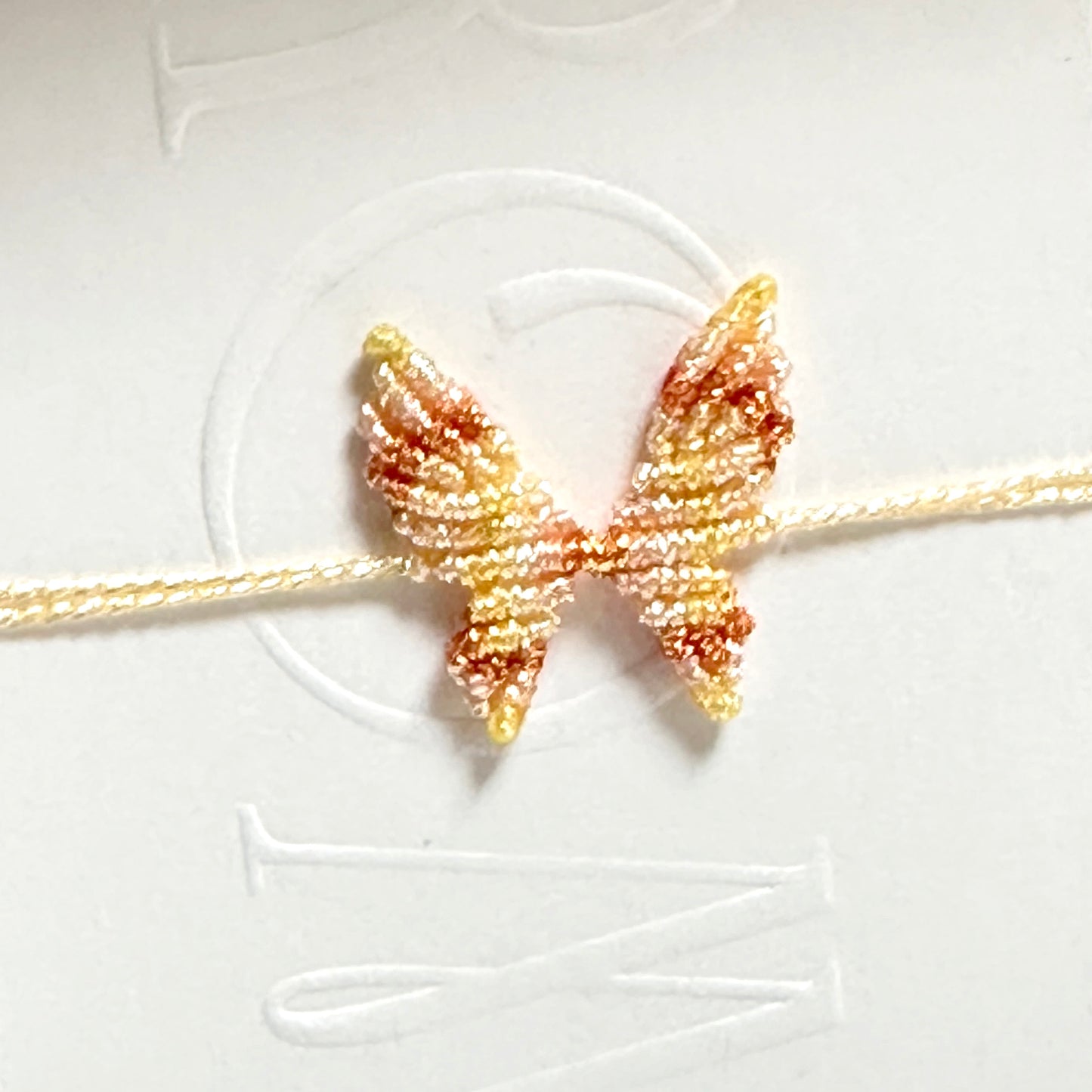 Handwoven gold and silver thread butterfly bracelet