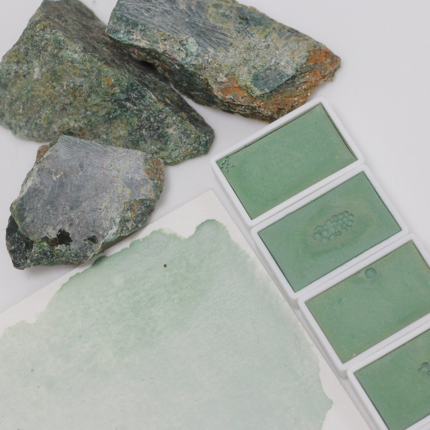 Emerald natural mineral emerald green handmade solid watercolor pigment is opaque.