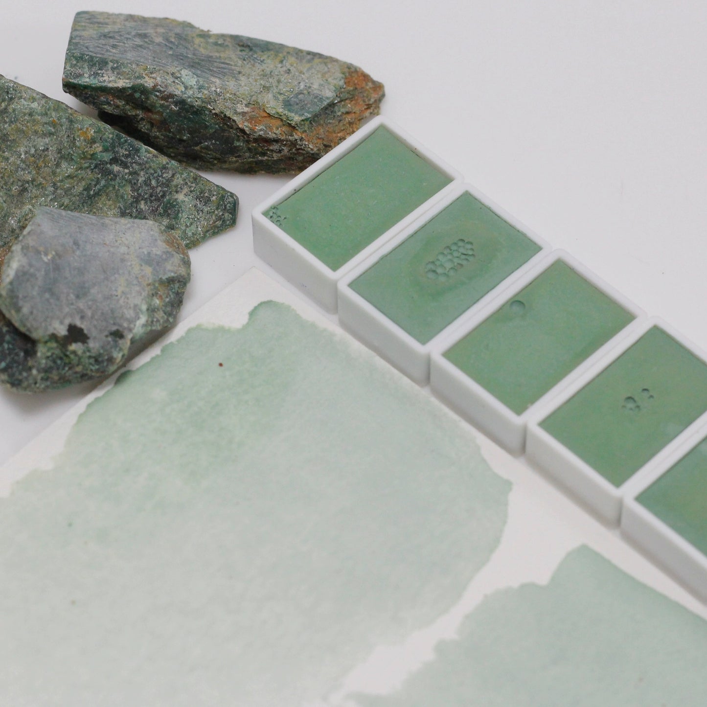 Emerald natural mineral emerald green handmade solid watercolor pigment is opaque.